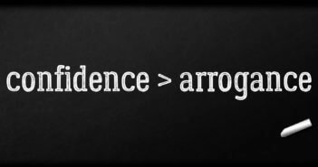 confidence > arrogance written in chalk