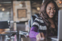 5 Reasons Why the Church of the Future Will be Online Smiling person using a laptop computer in a cafe