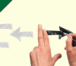 Person drawing arrows on a whiteboard
