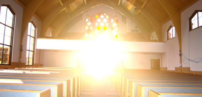 Interior of a church with beautiful, hopeful sunshine streaming in