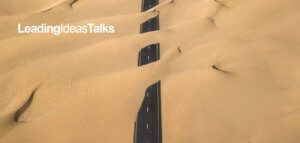 Road with sand blowing over it