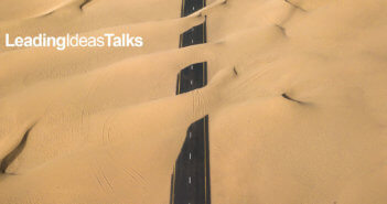 Road with sand blowing over it