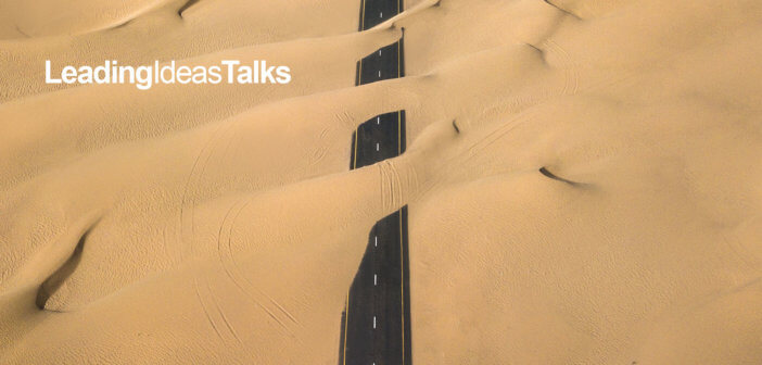 Road with sand blowing over it