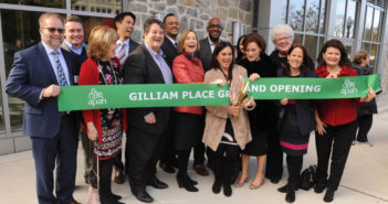 Members of Arlington Presbyterian Church help cut the ribbon on Gilliam Place -- affordable housing that was created in the redevelopment of the church building and property