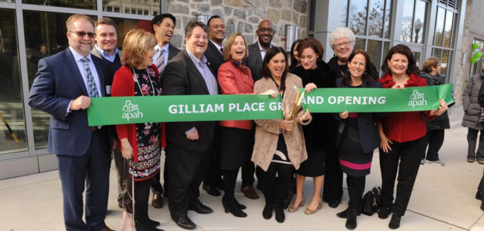 Members of Arlington Presbyterian Church help cut the ribbon on Gilliam Place -- affordable housing that was created in the redevelopment of the church building and property