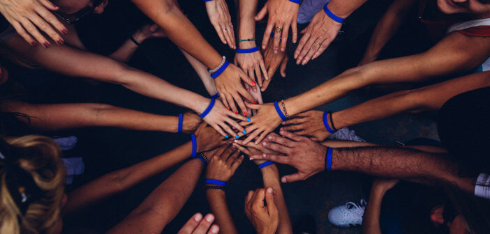 Group of people in a happy huddle