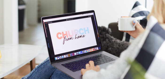 Person taking part in worship service on their computer while sitting on a couch in the living room