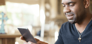 Person reading church news on a smart phone