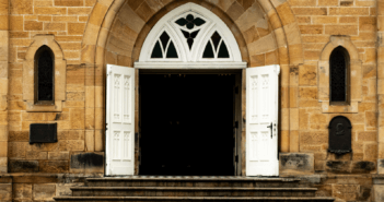 Old stone church with its door wide open