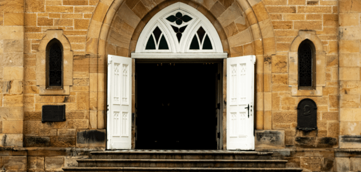 Old stone church with its door wide open