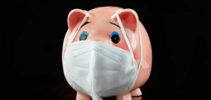 Piggy bank wearing a surgical mask