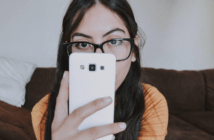 Connecting with Young Adults through Online Ministry Young adult looking up at you over their phone