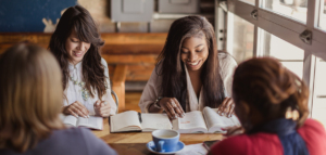 Young people in a Bible study in a coffee shop