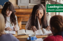 Young people having Bible study in a coffee shop