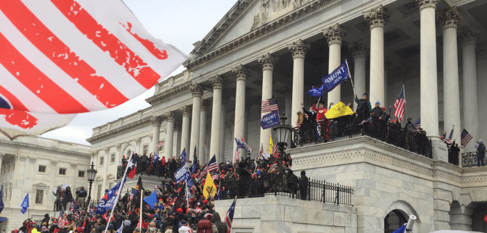 A crowd pressing up the steps towards the Senate Chamber of the Capitol