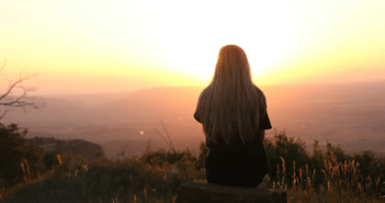 Helping People Connect with God through Nature Person taking in a beautiful sunrise