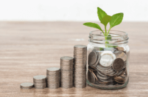 6 Simple Steps to Launch a Planned Giving Program Stacks of coins increasing in height and a seedling growing from a small vase filled with coins