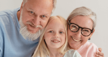 Smiling grandparents and grandchild