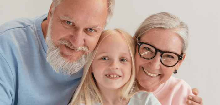 Smiling grandparents and grandchild