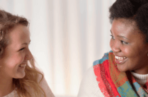 Relationships are the Key Ingredient in Successful Outreach Two smiling people in conversation