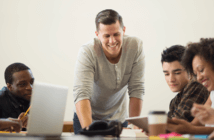Staffing When You Can’t Afford to Staff Church staff meeting with smiles