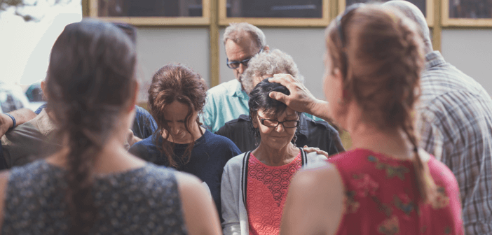 People being commissioned at church