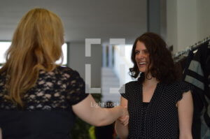Person receiving a warm greeting at church