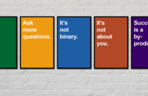 5 Signs I Need to Put on My Desk Posters hanging on a brick wall