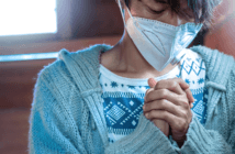 Leading Amid Controversy Over Masks and Vaccines Person praying in church