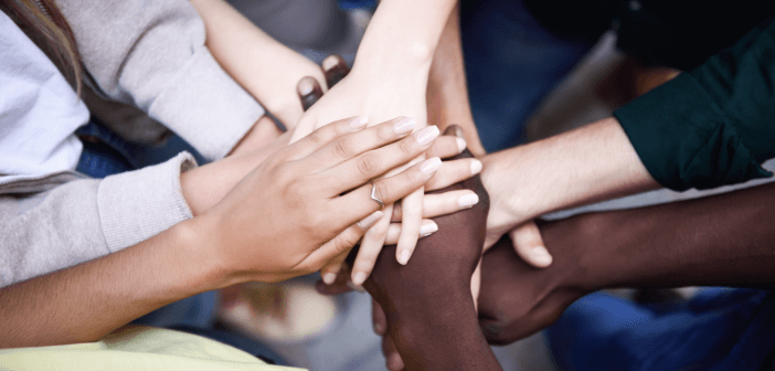 Stacked hands of diverse people