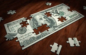 A puzzle in the shape of a $100 bill