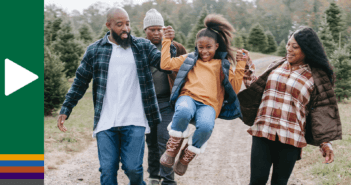 Family talking while walking down a gravel road