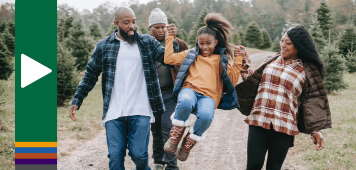 Family talking while walking down a gravel road