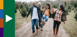 Family talking while walking down a gravel road