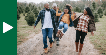 Family talking while walking down a gravel road