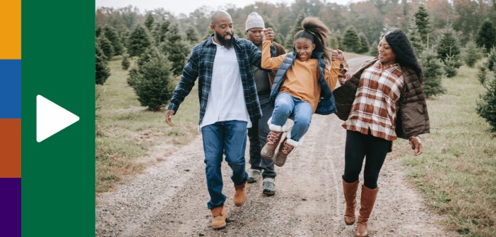 Family talking while walking down a gravel road