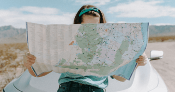 Person looking at a map in a barren landscape