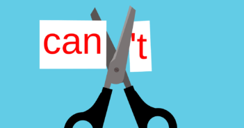 Scissors cutting the apostrophe T off of the word CANT