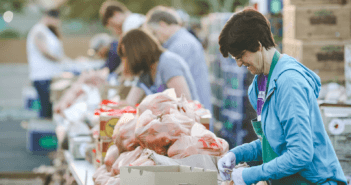 Church volunteers helping distribute free fresh vegetables and fruit