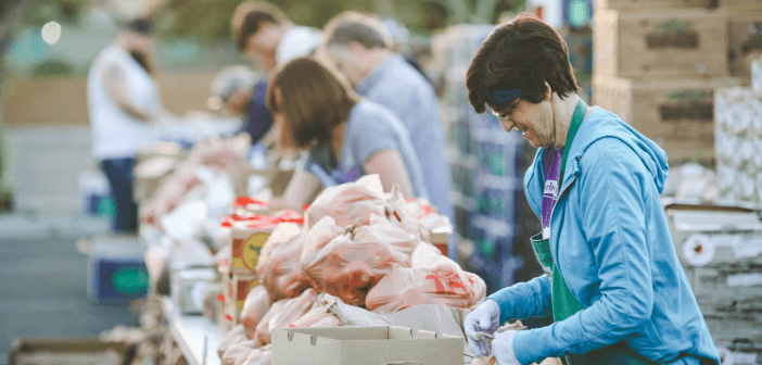 Church volunteers helping distribute free fresh vegetables and fruit