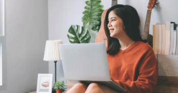 Person smiling while on the computer