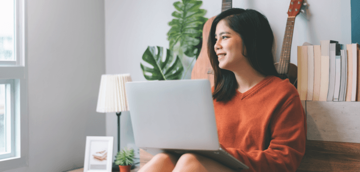 Person smiling while on the computer