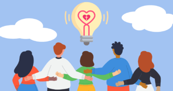 Illustration of people looking up at an idea light bulb with a heart filament
