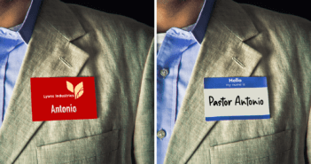 Pastor wearing a name tag from his M-F job and another one that says PASTOR