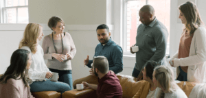 A person sharing their story in a small group