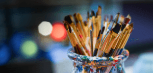 Artists paint brushes and paint splotches