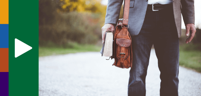 Person carrying both a messenger back for work and a Bible