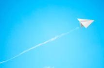 A New Model for Leading Change Paper airplane soaring into the sky