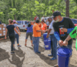 Volunteers for a line to pass supplies