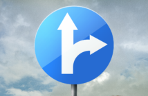 Road sign showing one my go straight forward or turn toward the right